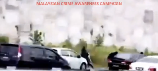 Viral Video showing motorist being robbed in Malaysia 